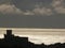 Silhouette of the castle of Lerici at sunset. Sky with clouds and sea