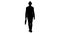Silhouette Casual arabian man walking in a hat and with a briefcase.