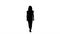 Silhouette Casual woman walking and smiling.