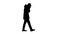 Silhouette Caucasian man in a hat and coat coughing walking.