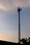 Silhouette cell phone towers with twilight sky.