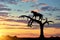 Silhouette of a cheetah in a tree