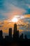 Silhouette of Chicago skyline viewed from the pier with orange a