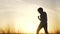 Silhouette child kid boxer. Boy a boxing with shadow exercising at sunset outdoor. Sun kid dream. Sport victory healthy