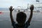 Silhouette of child looking at plane through the window of airport terminal. Family journey lifestyle