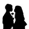 Silhouette of children kissing