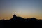 Silhouette of Christ the Redeemer Cristo Redentor at the top of mount Corcovado just after sunset during dusk in Rio de Janeiro