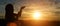 Silhouette of christian little girl open hands to praying for blessing from god at sunset background