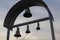 Silhouette of church bells against the evening sky