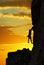 Silhouette of a climber over beautiful sunset