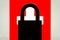 Silhouette of closed lock against flag of Switzerland on the background
