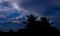 silhouette coconut tree with building construction, Beautiful cloudy sunset,view of clouds