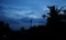 silhouette coconut tree with building construction, Beautiful cloudy sunset,view of clouds