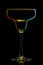 Silhouette of colorful margarita glass on black