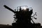 Silhouette of combine harvester destroyed by fire