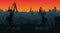 Silhouette commercial port with containers and cargo cranes, city skyline on background with sunset sky. Cityscape and cargo port
