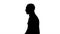 Silhouette Confident successful smart casual businessman walking.