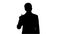 Silhouette Confident young businessman raising finger and foldin