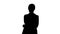 Silhouette Confident young businesswoman posing with crossed arms.