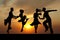 Silhouette couple in the active ballroom dance on sunset