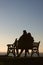 Silhouette of couple on bench