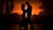 Silhouette of couple dancing in a country sunset