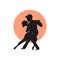 Silhouette of a couple dancing tango