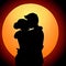 silhouette of a couple embracing in a warm and affectionate hug.