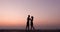 Silhouette of couple feeling love at sunset