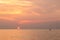 Silhouette of a couple on a kayak in the sea at sunset near koh Kood Island, Thailand Gulf of Siam