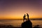 Silhouette of couple kiss on the beach at the sunrise and sunset