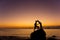 Silhouette of couple kiss on the beach at the sunrise and sunset