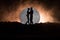 Silhouette of couple kissing under full moon. Guy kiss girl hand on full moon silhouette background. Valentine`s day decor concept