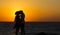 Silhouette of a couple in love on the beach at sunset.Love story.Man and a woman on the beach.