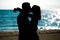 Silhouette of a couple in love on the beach at sunset.Love story.Man and a woman on the beach