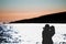 Silhouette of a couple in love on the beach at sunset.Love story.Man and a woman on the beach