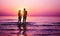 Silhouette of couple in love running inside ocean water at sunset - Lovers having tender moments summer vacation - Holidays,