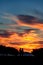 Silhouette of a couple at majestic cloduy sunset