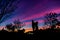 Silhouette Couple Man and Woman Cuddle with Happily among Beautiful Sunset Sky in Nature