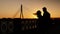 Silhouette of Couple Met at Evening Sunset .