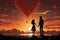 silhouette of a couple releasing heart shaped balloon