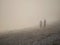 Silhouette of a couple on a stone beach in a fog. Blackrock beach, Salthill, Galway city, Ireland