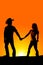 Silhouette couple western hands look back