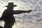 Silhouette of Cowboy aiming pistol
