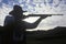 Silhouette of Cowboy aiming rifle