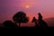 The silhouette of the cowboy and setting sunset