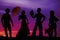 Silhouette of cowboys and women