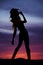 Silhouette cowgirl lean back look up