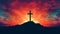 Silhouette of cross with backdrop of sunset