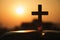 Silhouette of cross and bible with the sunset as background, christian concept, spirituality and religion